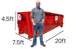 man in front of 20 yard roll off dumpster rental